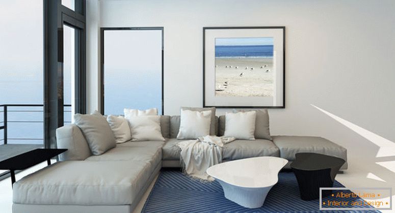 Salon moderne au bord de l'eau avec un intérieur spacieux et lumineux avec une confortable suite gris rembourrée, des œuvres d'art sur le mur et une grande fenêtre panoramique sur un mur surplombant l'océan