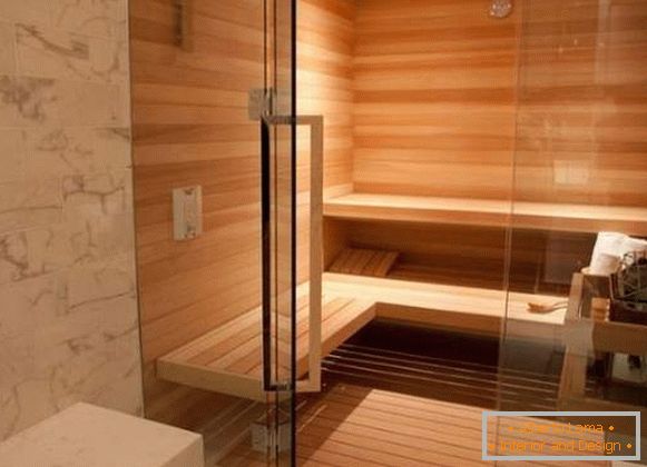 Raccords chromés pour portes vitrées dans le sauna - poignées de porte