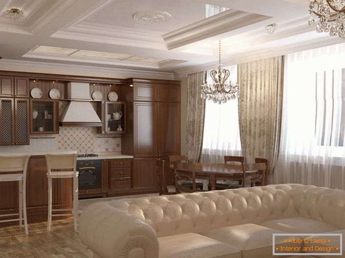 Le salon-cuisine est décoré dans un style Art Nouveau. Les couleurs claires, les meubles en bois naturel, les lustres en cristal massif sont assortis au style.