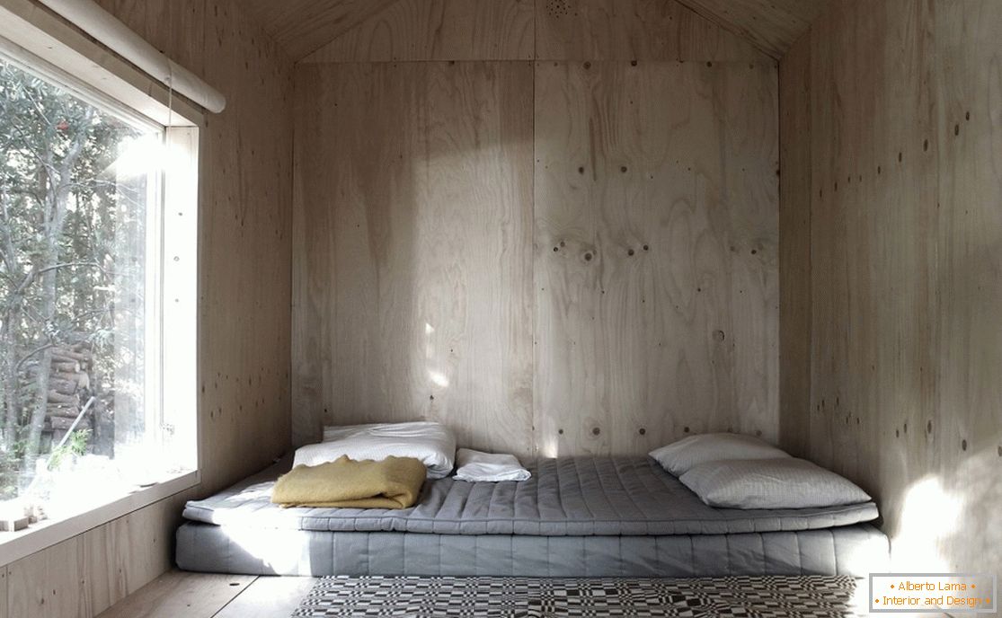 La chambre de la mini maison Ermitage en Suède