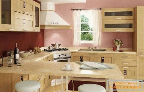 L'intérieur de la cuisine d'angle avec comptoir de bar - une photo dans les tons beige et rose
