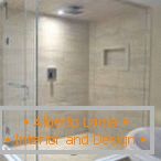 Cabine de douche avec dalles de sable et porte blanche