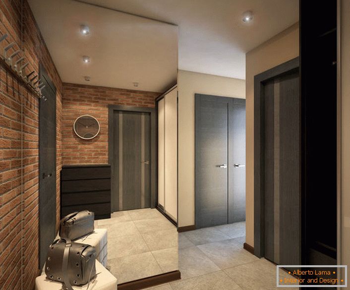 Le projet de conception du couloir est une version soignée du style loft (mur de briques) et la couleur d'un noble wengé.