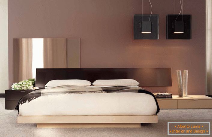Un design minimaliste avec des notes de couleur japonaise dans la chambre d'un appartement français ordinaire. 